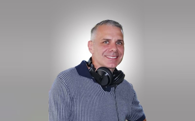person with headphones around neck